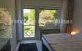 FeWo das Schlafzimmer mit Blick in den Garten